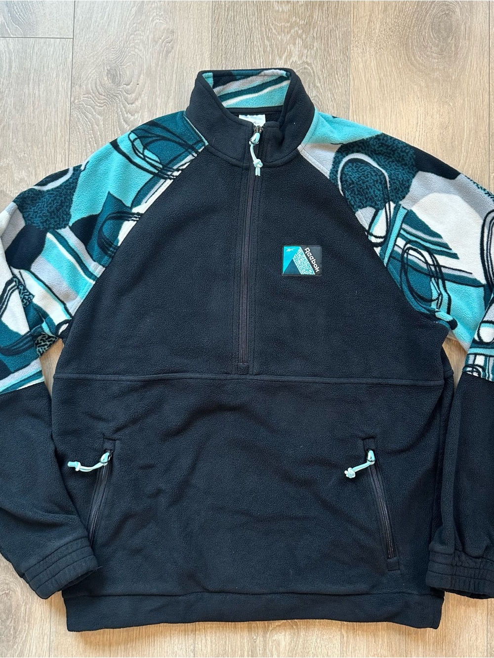 Vintage-style Reebok Men’s Black and Teal Half-Zip Fleece Pullover Size Small